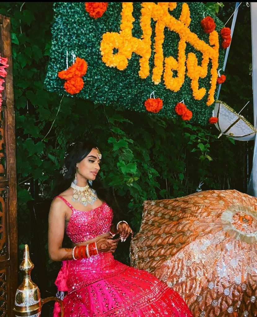 Bride posing for the camera at her Sangeet